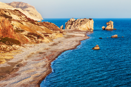 Panoramic sunset landscape of Petra tou Romiou (The rock of the Greek), Aphrodite's legendary birthplace in Paphos, Cyprus island, Mediterranean Sea.の写真素材