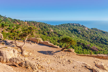 Sea skyview landscape photo from ruins of Monolithos castle on Rhodes island, Dodecanese, Greece. Panorama with green mountains and clear blue water. Famous tourist destination in South Europeの写真素材