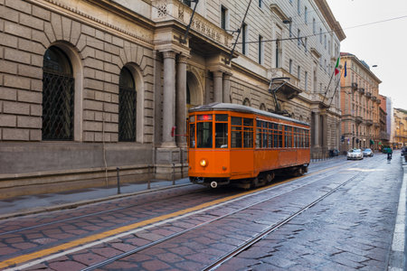 Old vintage tram in the city center of the Milan, Lombardia, Italy. Famous tourist destination in South Europeの写真素材