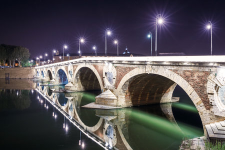 French ancient town Toulouse and Garonne river panoramic night view. Toulouse is the capital of Haute Garonne department and Occitanie region, France, South Europe. famous tourist destination.の写真素材