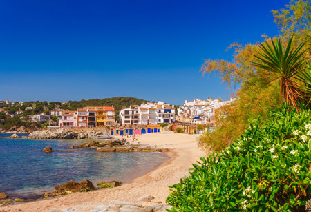 Sea landscape with Calella de Palafrugell, Catalonia, Spain near of Barcelona. Scenic fisherman village with nice sand beach and clear blue water in nice bay. Famous tourist destination in Costa Bravaの写真素材