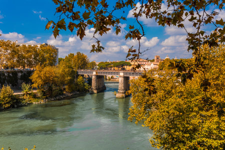 Skyline landscape of beautiful Roma from the Tiber shore in a clear blue sky and sunny day. Famous tourist destination in Italyの写真素材