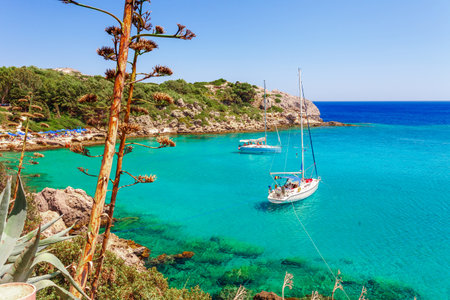 Sea skyview landscape photo Ladiko bay near Anthony Quinn bay on Rhodes island, Dodecanese, Greece. Panorama with nice sand beach and clear blue water. Famous tourist destination in South Europeの写真素材