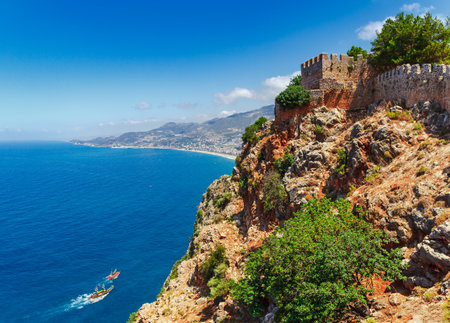 Beautiful sea panorama landscape of Alanya Castle in Antalya district, Turkey, Asia. Famous tourist destination with high mountains. Summer bright day and sea shoreの写真素材