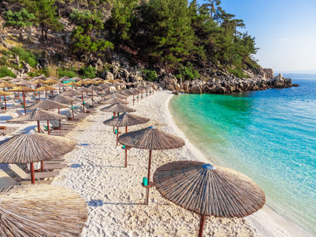 Parasols and umbrellas on a beautiful beach in Greeceの写真素材