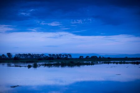 Evening sky over water.の写真素材