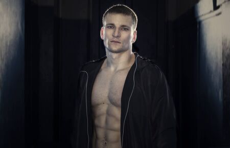 Young sporty man in the hoodの写真素材