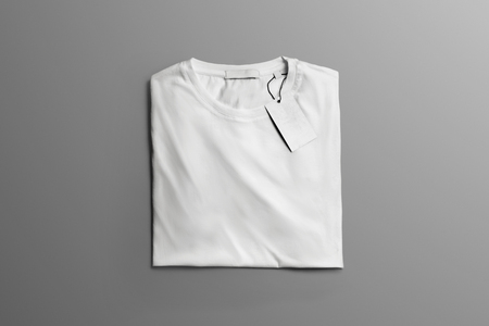 Studio mockup  of clothes. Neatly folded blank T-shirt  lies on the gray background  with shadows. Template can use for you showcase.の写真素材