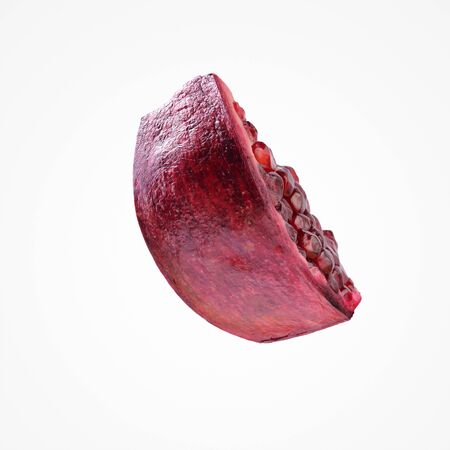 Subtropic fruit composition. Healthy bright red piece pomergranate isolat on blank studio background.の写真素材