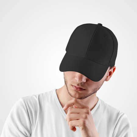 Black baseball cap template for sports, on the head of a guy with a beard,の写真素材