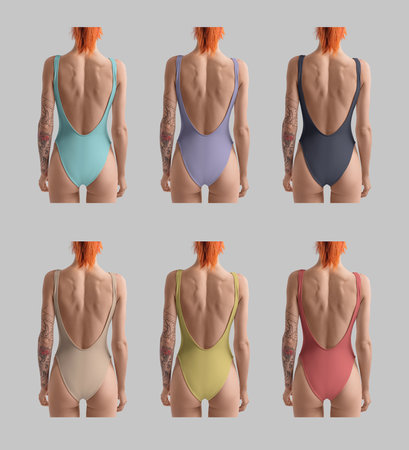 Mockup of a colored one piece of sportswear on a girl with red hair, a swimsuit with an open back, for design. Set of women's swimwear. Product photography. Bodysuit template, isolated on backgroundの写真素材