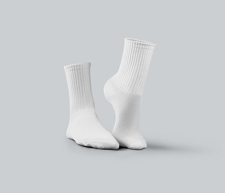 Template of white medium socks 3d rendering, stretched toes, gaiters isolated on background, side view. Mockup of a pair of clothes with an elastic band for design, advertisingの写真素材