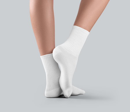 Mockup of white medium socks on women's feet, stretched toes, isolated on background, side view. Template of stiletto gaiters with elastic middle band, for design. Pair of apparel on feetの写真素材