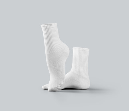 Mockup of white medium socks 3d rendering, stretched toes, gaiters with elastic average band, isolated on background, side view. Template of a pair of clothes for design, branding, advertisingの写真素材