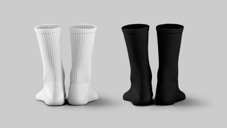 Mockup of white, black long socks, 3D rendering, back view, isolated on background with shadows. Set of clothes for legs. Template of fashionable high gaiters, for design, print, advertisingの写真素材