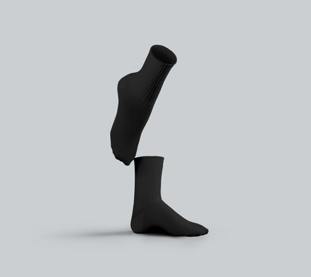 Black medium socks template 3D rendering, one foot raised and stretched, side view, isolated on background. Average clothes mockup for feet. Fashionable clothes for legs, for design.の写真素材