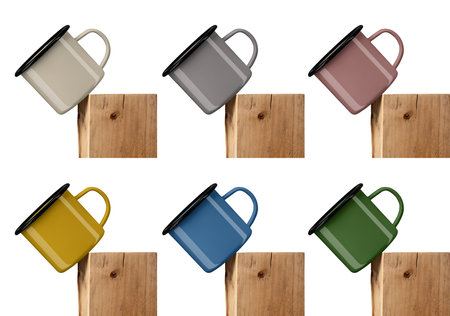 Mockup of colorful enamel mugs with black rim, on old wooden timber, diagonal presentation. Set of falling iron cups, isolated on background. Metal mugs template, for design, branding, advertising.の写真素材