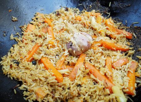 Picture of cooking pilaf on black bowl.の写真素材