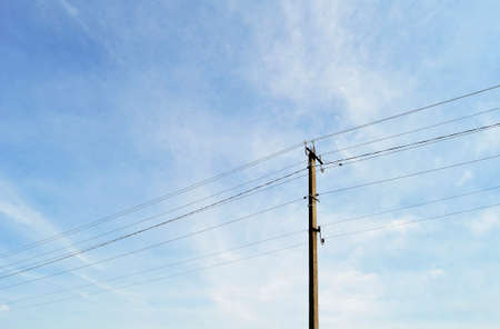 Power electric pole with line wire on colored background close up. Photography consisting of power...