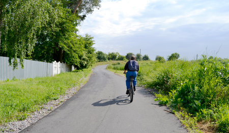 Beautiful empty asphalt road in countryside on colored background. Photography consisting of new empty asphalt road passing through countryside. Empty asphalt road for speed car in foliage countrysideの写真素材