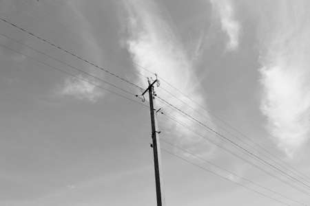 Power electric pole with line wire on colored background close up, photography consisting of power...