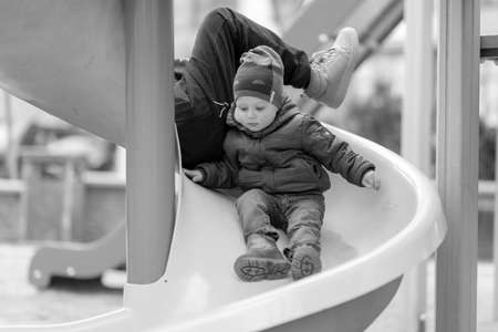 Beautiful baby boy with child face posing photographer for color photo, cadre consisting of baby boy in child image, caucasian expression face, healthy baby boy in child face relaxing for good shotの写真素材