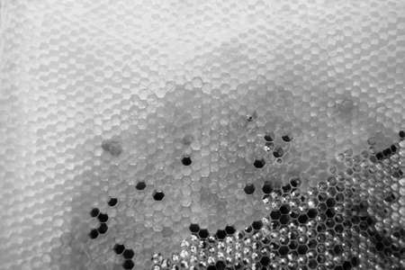 Drop of bee honey drip from hexagonal honeycombs filled with golden nectar, honeycombs summer...