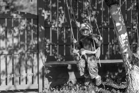 Beautiful baby boy with child face posing photographer for color photo, cadre consisting of baby boy in child image, caucasian expression face, healthy baby boy in child face relaxing for good shotの写真素材