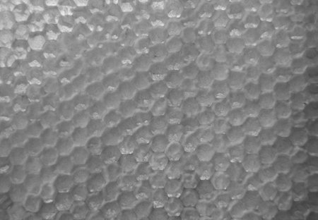 Drop of bee honey drip from hexagonal honeycombs filled with golden nectar, honeycombs summer composition consisting of drop natural honey, drip on wax frame bee, drop of bee honey drip in honeycombsの写真素材