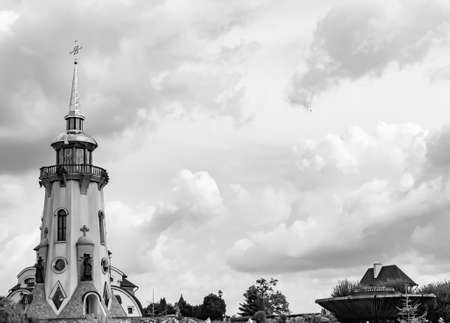 Christian church cross in high steeple tower for prayer, photography consisting of beautiful church with cross on steeple tower to sincere prayer, cross steeple tower is church over clear skyの写真素材