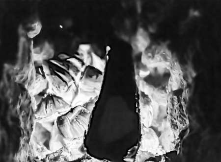 Beautiful old fireplace with light flame fire for heating building room, old fireplace consisting of...