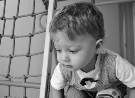 Beautiful baby boy with child face posing photographer for color photo, cadre consisting of baby boy in child image, caucasian expression face, healthy baby boy in child face relaxing for good shotの写真素材