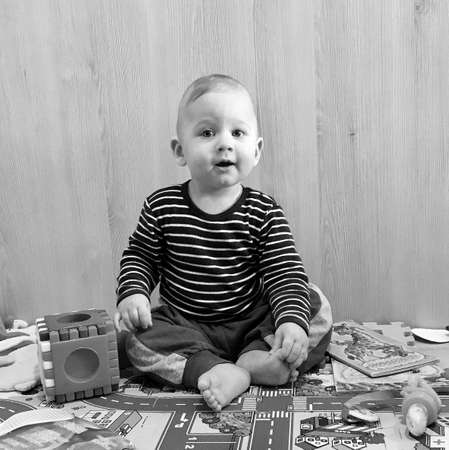 Beautiful baby boy with child face posing photographer for color photo, cadre consisting of baby boy...