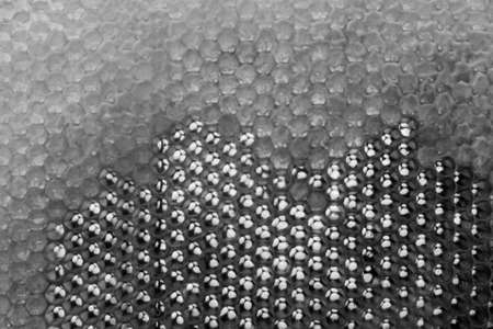 Drop of bee honey drip from hexagonal honeycombs filled with golden nectar, honeycombs summer...