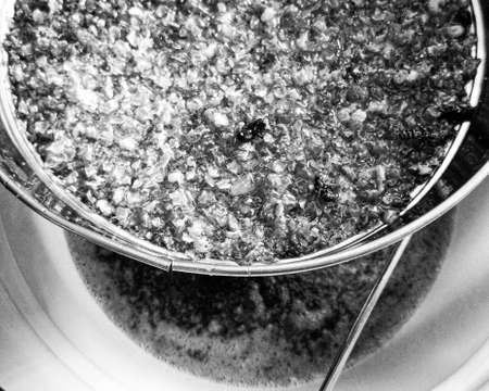 Drop of bee honey drip from hexagonal honeycombs filled with golden nectar, honeycombs summer...