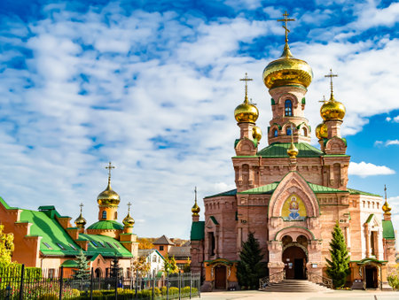Christian church cross in high steeple tower for prayer, photography consisting of beautiful church with cross on steeple tower to sincere prayer, cross steeple tower is church over clear skyの写真素材
