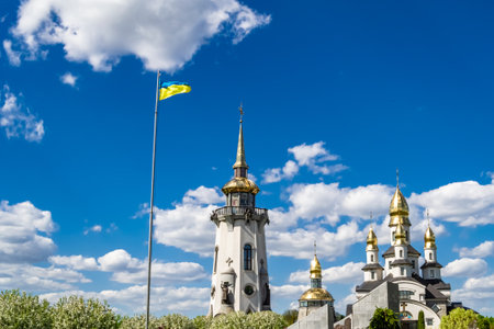 Christian church cross in high steeple tower for prayer, photography consisting of beautiful church with cross on steeple tower to sincere prayer, cross steeple tower is church over clear skyの写真素材