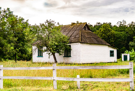 Beautiful old abandoned building farm house in countryside on natural background, photography consisting of old abandoned building farm house at wild grass, old abandoned building farm house over skyの写真素材