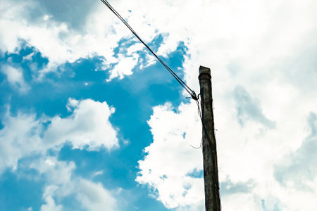 Power electric pole with line wire on colored background close up, photography consisting of power...