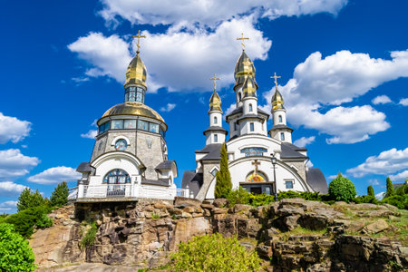 Christian church cross in high steeple tower for prayer, photography consisting of beautiful church with cross on steeple tower to sincere prayer, cross steeple tower is church over clear skyの写真素材