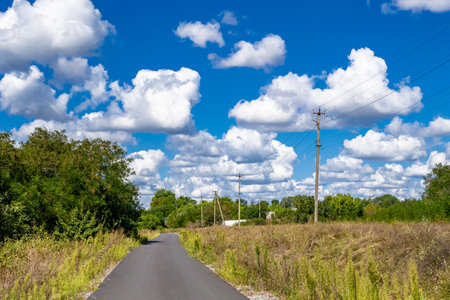 Beautiful empty asphalt road in countryside on colored background, photography consisting of new empty asphalt road passing through countryside, empty asphalt road for speed car in foliage countrysideの写真素材
