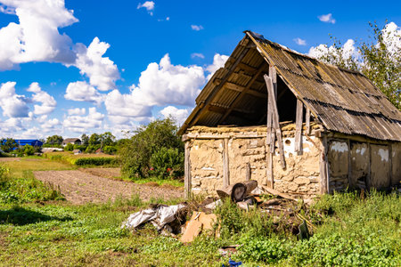Beautiful old abandoned building farm house in countryside on natural background, photography consisting of old abandoned building farm house at wild grass, old abandoned building farm house over skyの写真素材