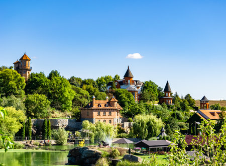 Photography on theme ancient brick castle with large tower on background natural nature, photo consisting of ancient brick castle with big tower, ancient brick castle with high tower in cloudy skyの写真素材