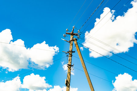 Power electric pole with line wire on colored background close up, photography consisting of power electric pole with line wire under sky, line wire in power electric pole for residential buildingsの写真素材