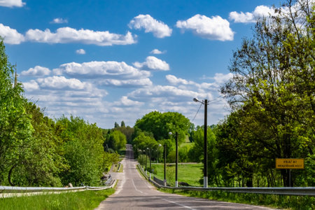 Beautiful empty asphalt road in countryside on colored background, photography consisting of new empty asphalt road passing through countryside, empty asphalt road for speed car in foliage countrysideの写真素材