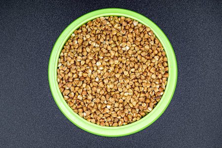 Beautiful organic dry buckwheat grains consisting of raw natural product. Dry buckwheat grains this is tasty food ingredient of porridge. Edible and healthy of dry hulled buckwheat grains from natureの写真素材