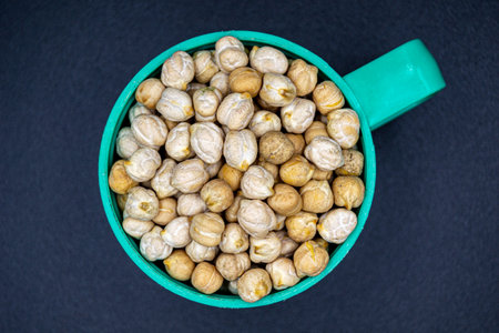 Beautiful organic dried chickpea beans consisting of raw Bengal legume pea. Dry egyptian legume pea seeds this is tasty food ingredient of chickpea beans. Edible healthy chickpea beans in legume peaの写真素材