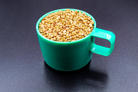 Beautiful organic dry buckwheat grains consisting of raw natural product. Dry buckwheat grains this is tasty food ingredient of porridge. Edible and healthy of dry hulled buckwheat grains from natureの写真素材