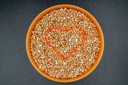 Beautiful organic dry buckwheat grains consisting of raw natural product. Dry buckwheat grains this is tasty food ingredient of porridge. Edible and healthy of dry hulled buckwheat grains from natureの写真素材