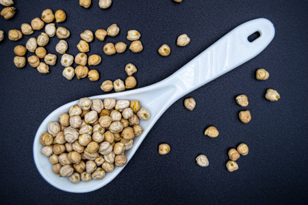 Beautiful organic dried chickpea beans consisting of raw Bengal legume pea. Dry egyptian legume pea seeds this is tasty food ingredient of chickpea beans. Edible healthy chickpea beans in legume peaの写真素材